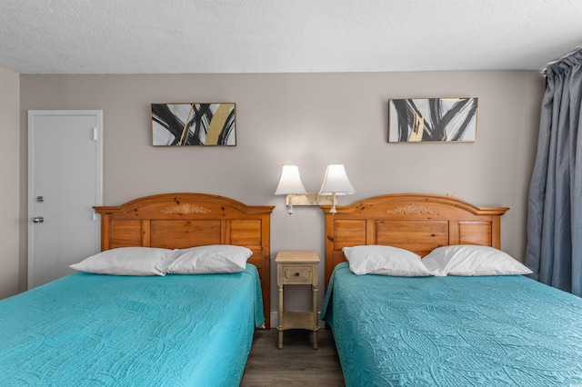 202 74th Ave N Unit 2547/2548, Myrtle Beach, SC 29572 - bedroom featuring wood finished floors and a textured ceiling