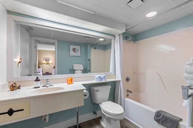 202 74th Ave N Unit 2547/2548, Myrtle Beach, SC 29572 - bathroom with a sink, wood finished floors, toilet, shower / tub combo with curtain, and connected bathroom