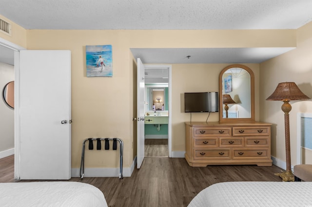 202 74th Ave N Unit 2547/2548, Myrtle Beach, SC 29572 - bedroom with dark wood finished floors, baseboards, and a textured ceiling