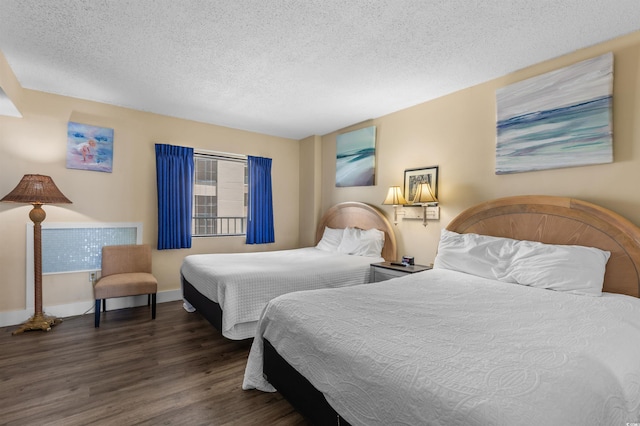 202 74th Ave N Unit 2547/2548, Myrtle Beach, SC 29572 - bedroom featuring wood finished floors, a textured ceiling, and baseboards