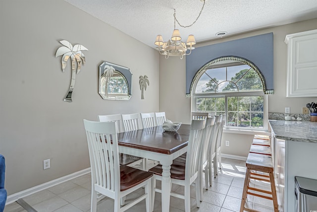 500 23rd Ave S, North Myrtle Beach, SC 29582 - dining space with a chandelier, light tile patterned flooring, baseboards, and a textured ceiling