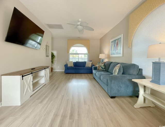 500 23rd Ave S, North Myrtle Beach, SC 29582 - living area featuring light wood-style floors, ceiling fan, and baseboards
