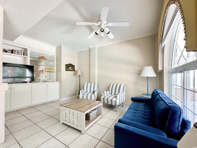 500 23rd Ave S, North Myrtle Beach, SC 29582 - living room featuring light tile patterned flooring, a ceiling fan, plenty of natural light, and a textured ceiling