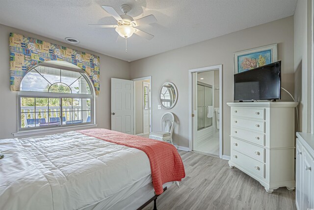 500 23rd Ave S, North Myrtle Beach, SC 29582 - bedroom featuring light wood-style flooring, baseboards, ensuite bathroom, and a ceiling fan