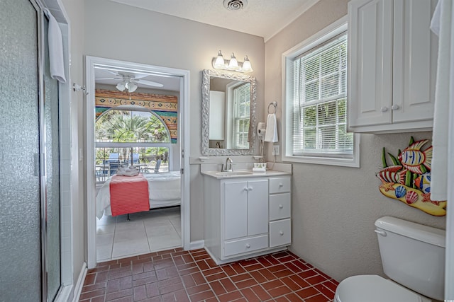 500 23rd Ave S, North Myrtle Beach, SC 29582 - bathroom featuring brick floors, vanity, healthy amount of natural light, and a stall shower