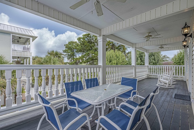 500 23rd Ave S, North Myrtle Beach, SC 29582 - wooden deck with a ceiling fan and outdoor dining space