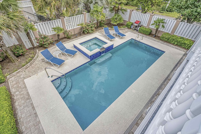 500 23rd Ave S, North Myrtle Beach, SC 29582 - view of pool featuring a fenced backyard, a patio, and a pool with connected hot tub
