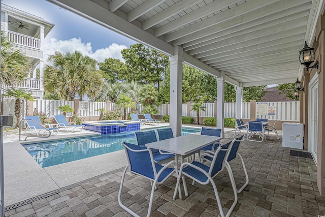 500 23rd Ave S, North Myrtle Beach, SC 29582 - view of swimming pool with outdoor dining space, a fenced backyard, a patio, and a pool with connected hot tub