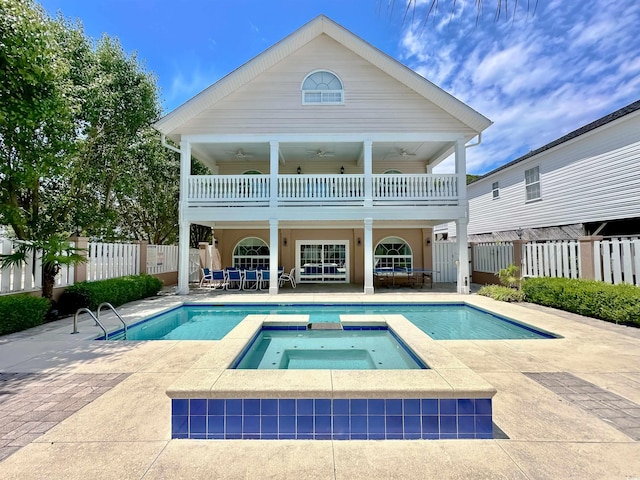500 23rd Ave S, North Myrtle Beach, SC 29582 - back of house featuring a balcony, ceiling fan, a fenced backyard, and a patio