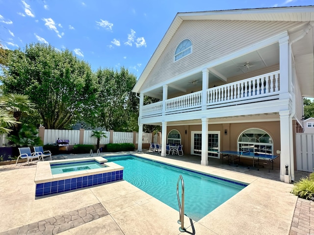 500 23rd Ave S, North Myrtle Beach, SC 29582 - rear view of property with a ceiling fan, an in-ground hot tub, a balcony, and a patio area