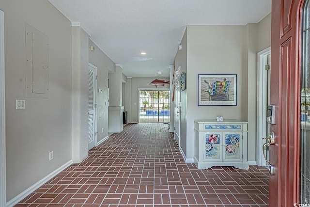 500 23rd Ave S, North Myrtle Beach, SC 29582 - hallway featuring baseboards, brick patterned floors, electric panel, and recessed lighting