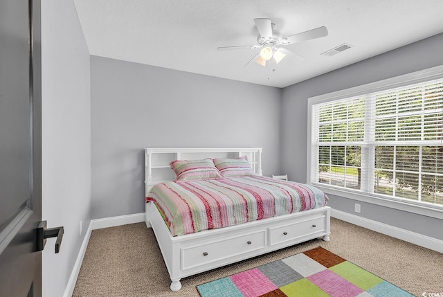 bedroom with carpet floors, baseboards, and ceiling fan
