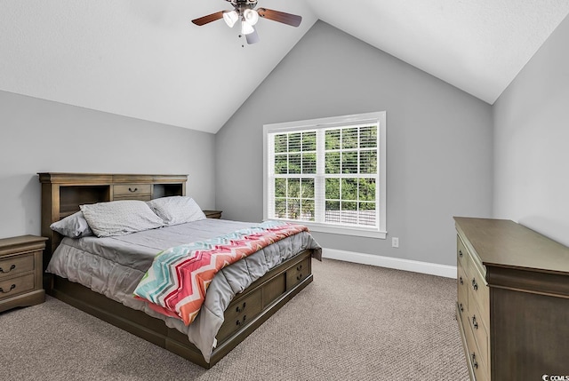 bedroom with carpet, lofted ceiling, baseboards, and a ceiling fan