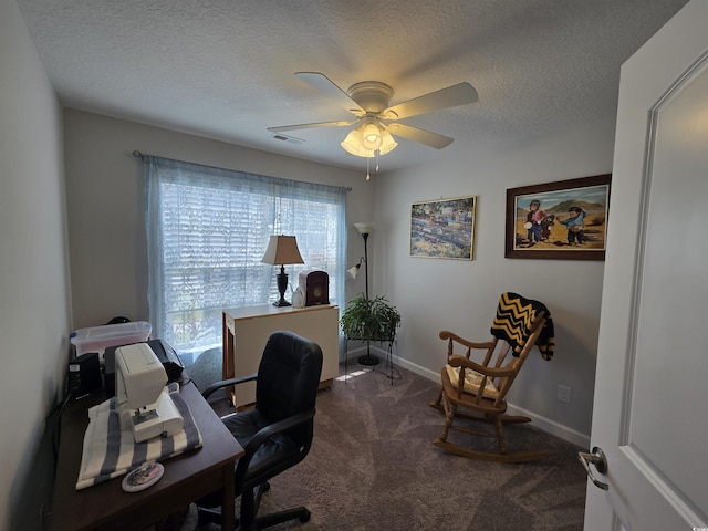 carpeted office with ceiling fan, baseboards, and a textured ceiling