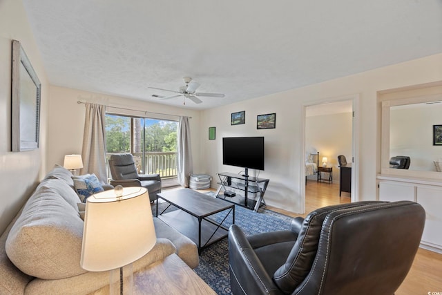 69 Pinehurst Ln Unit 3-F, Pawleys Island, SC 29585 - living room with wood finished floors and ceiling fan
