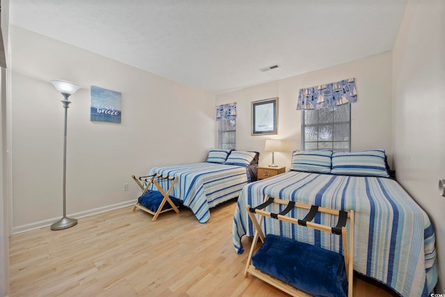 69 Pinehurst Ln Unit 3-F, Pawleys Island, SC 29585 - bedroom with wood finished floors and baseboards