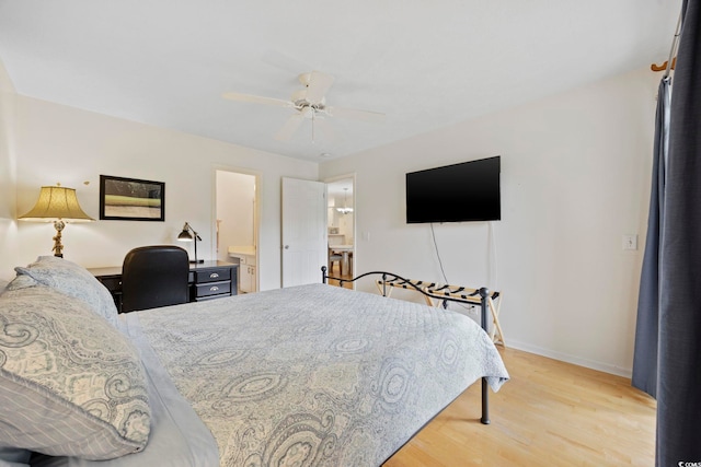 69 Pinehurst Ln Unit 3-F, Pawleys Island, SC 29585 - bedroom featuring light wood finished floors, baseboards, ensuite bath, and a ceiling fan