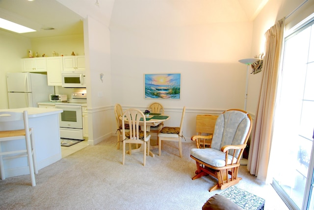 400 Lands End Blvd Unit 5304, Myrtle Beach, SC 29572 - dining area featuring light colored carpet and a wainscoted wall
