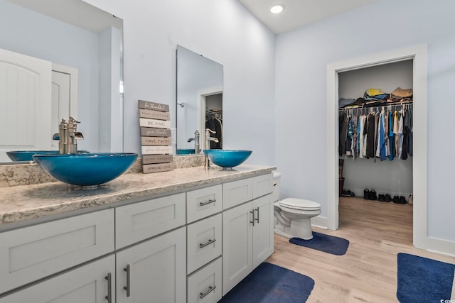 400 Elizabeth Dr, Murrells Inlet, SC 29576 - full bathroom featuring double vanity, wood finished floors, toilet, and a spacious closet