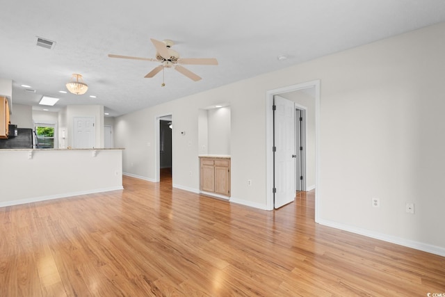 4520 Coquina Harbour Dr Unit F-3, Little River, SC 29566 - unfurnished living room featuring light wood-style floors and ceiling fan