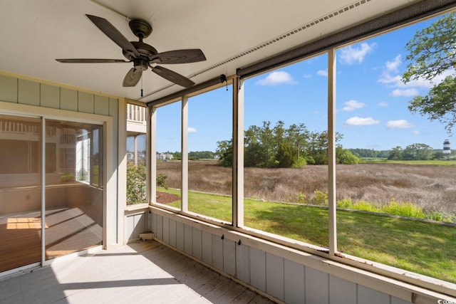4520 Coquina Harbour Dr Unit F-3, Little River, SC 29566 - unfurnished sunroom with a ceiling fan and a view of countryside