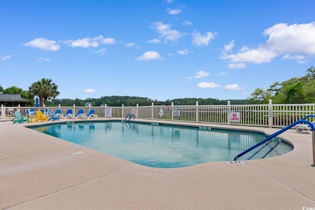 4520 Coquina Harbour Dr Unit F-3, Little River, SC 29566 - community pool featuring a patio