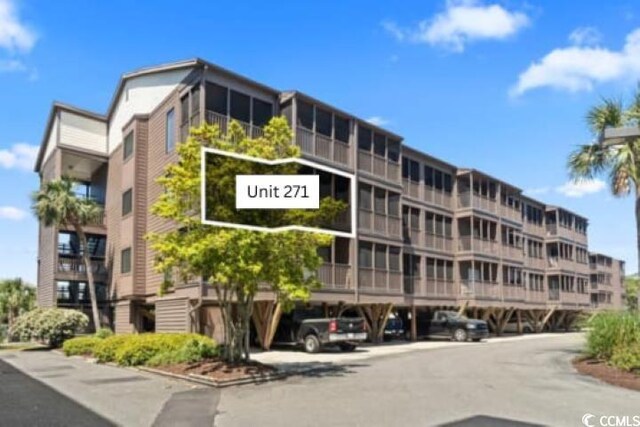 206 2nd Ave N Unit 271, North Myrtle Beach, SC 29582 - view of apartment building / complex featuring covered parking
