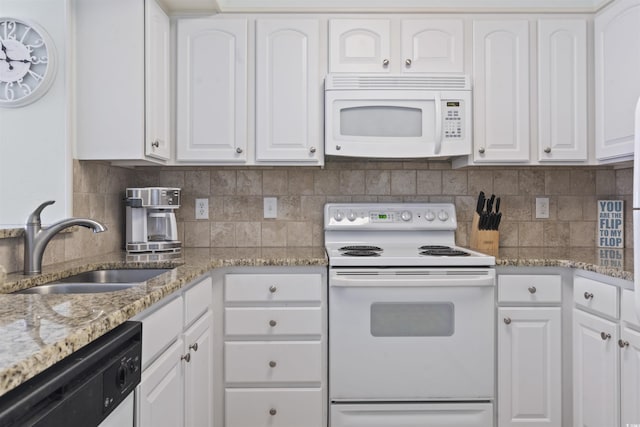 206 2nd Ave N Unit 271, North Myrtle Beach, SC 29582 - kitchen featuring white appliances, a sink, white cabinets, and tasteful backsplash