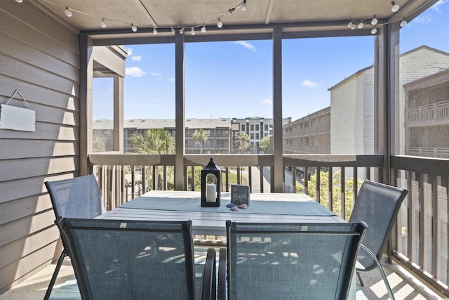 206 2nd Ave N Unit 271, North Myrtle Beach, SC 29582 - sunroom / solarium featuring outdoor dining space and track lighting