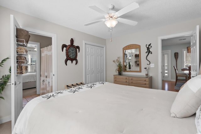 9679 Stillwater Ct, Myrtle Beach, SC 29572 - tiled bedroom with a closet, a ceiling fan, and connected bathroom