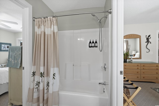 bathroom featuring ensuite bath, a ceiling fan, shower / tub combo with curtain, and a textured ceiling