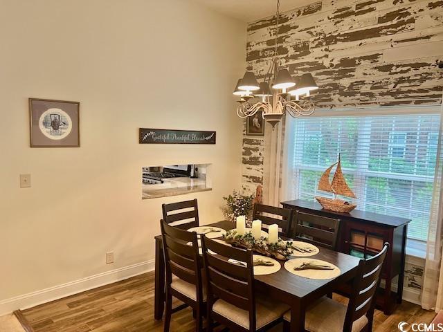 1504 Saint Thomas Cir, Myrtle Beach, SC 29577 - dining room featuring plenty of natural light, baseboards, a chandelier, and wood finished floors