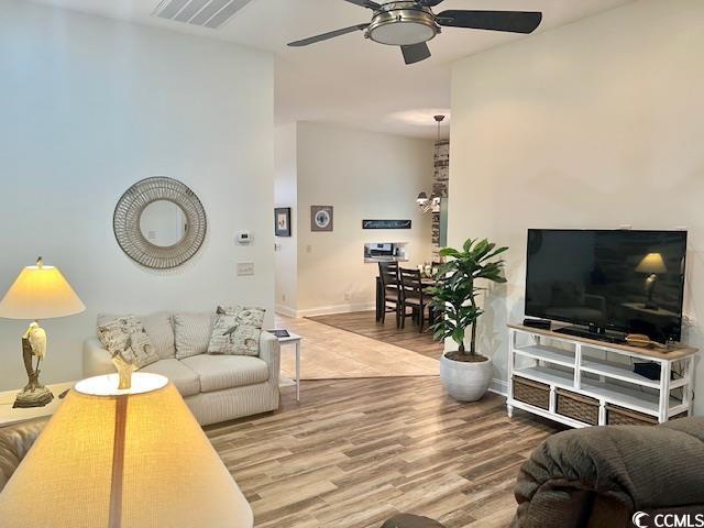 1504 Saint Thomas Cir, Myrtle Beach, SC 29577 - living area with ceiling fan, wood finished floors, and baseboards