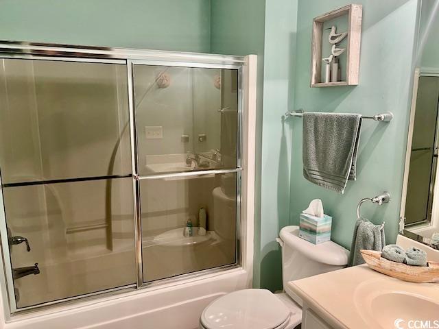 1504 Saint Thomas Cir, Myrtle Beach, SC 29577 - full bathroom with vanity, toilet, and bath / shower combo with glass door