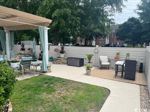 1504 Saint Thomas Cir, Myrtle Beach, SC 29577 - view of yard with a pergola, a wooden deck, and a patio