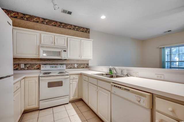 1058 Sea Mountain Hwy Unit 4-203, North Myrtle Beach, SC 29582 - kitchen with white appliances, a sink, light countertops, a textured ceiling, and recessed lighting