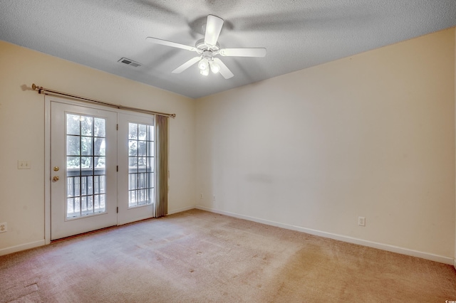 1058 Sea Mountain Hwy Unit 4-203, North Myrtle Beach, SC 29582 - spare room with light carpet, baseboards, ceiling fan, and a textured ceiling