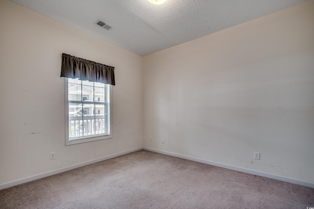 1058 Sea Mountain Hwy Unit 4-203, North Myrtle Beach, SC 29582 - carpeted spare room featuring baseboards and a textured ceiling
