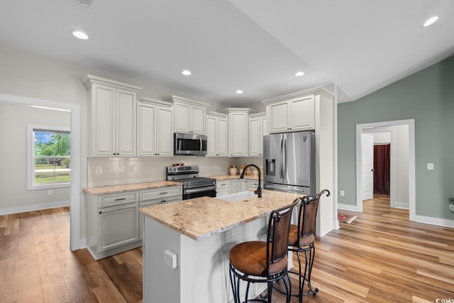 2505 Suzanne Dr, Conway, SC 29526 - kitchen with stainless steel appliances, a sink, baseboards, light wood-style flooring, and recessed lighting
