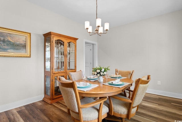 2505 Suzanne Dr, Conway, SC 29526 - dining space with a chandelier, baseboards, and dark wood-type flooring