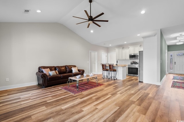 2505 Suzanne Dr, Conway, SC 29526 - living room featuring a ceiling fan, light wood finished floors, vaulted ceiling, recessed lighting, and baseboards