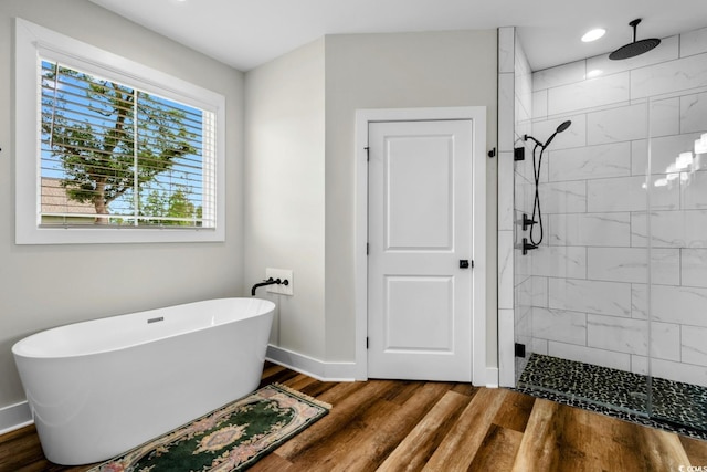 2505 Suzanne Dr, Conway, SC 29526 - bathroom with a stall shower, a soaking tub, baseboards, wood finished floors, and recessed lighting