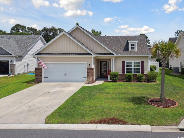 309 Rycola Cir, Surfside Beach, SC 29575 - craftsman-style home with an attached garage, a front yard, roof with shingles, and driveway