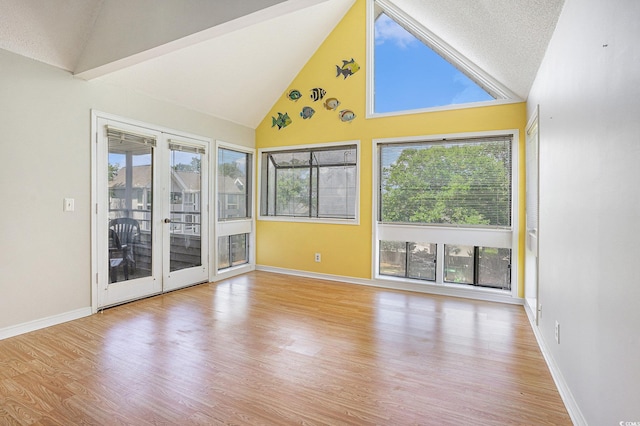 351 Lake Arrowhead Rd Unit 24-396, Myrtle Beach, SC 29572 - empty room featuring high vaulted ceiling, wood finished floors, and plenty of natural light