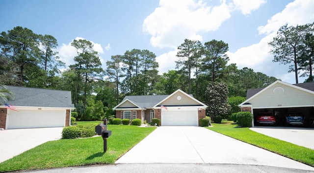 view of front facade featuring brick siding, a front yard, and driveway