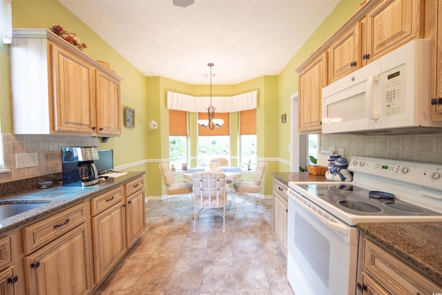 kitchen with white appliances, a chandelier, baseboards, and decorative backsplash