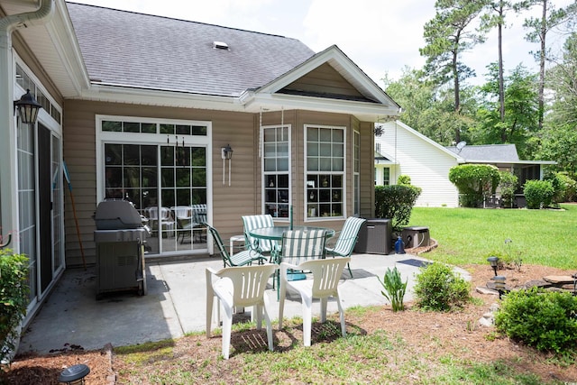 view of patio featuring a grill