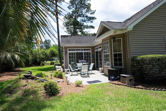 view of grassy yard with a patio