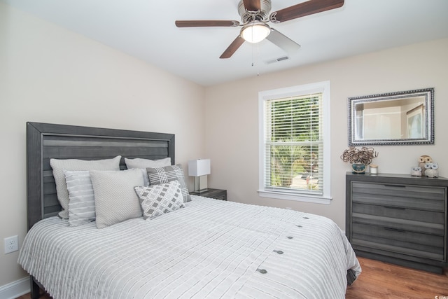 bedroom featuring wood finished floors and ceiling fan