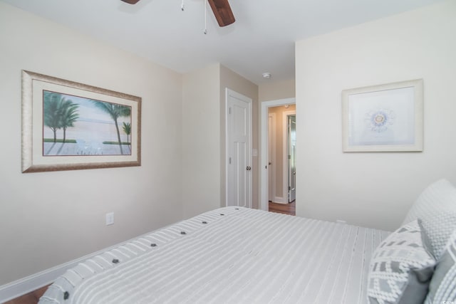 bedroom featuring ceiling fan and baseboards